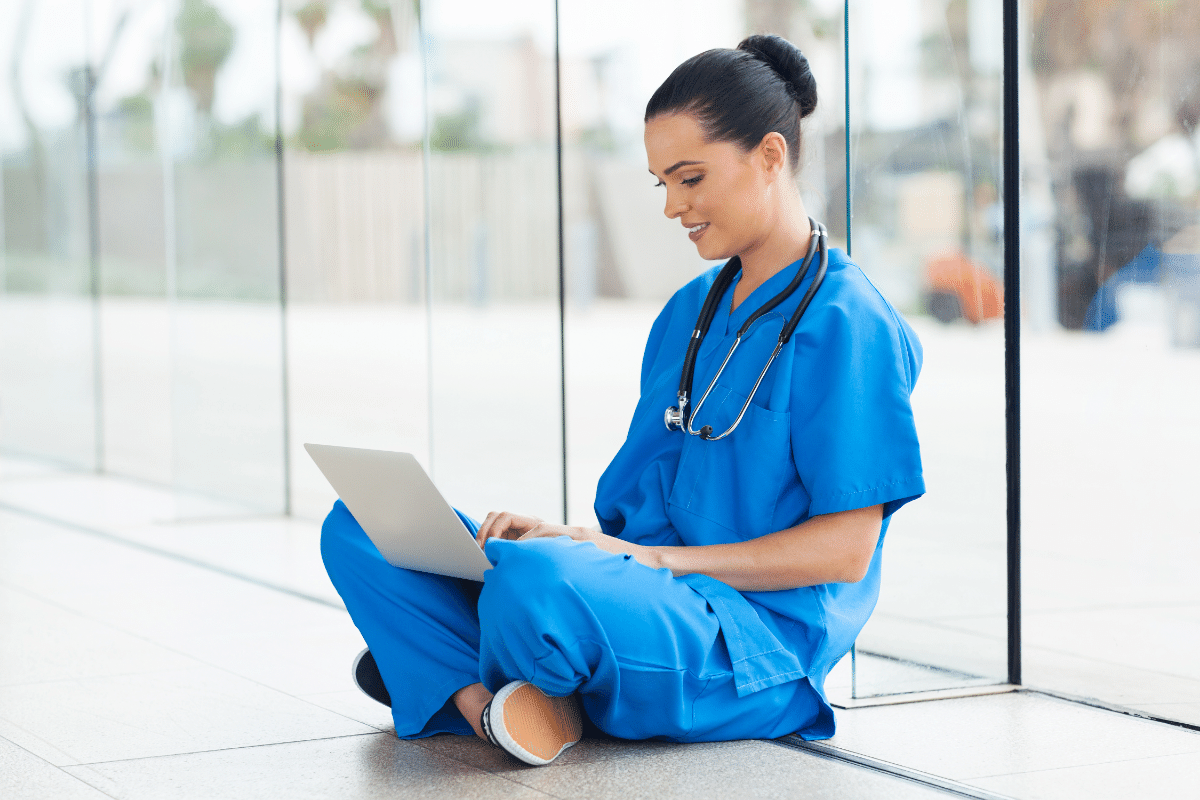 nurse taking survey on a laptop